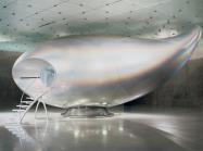 Mariko Mori, Wave UFO, 1999-2002, Brainwave interface, vision dome, projector, computer system, fiberglass, Technogel, acrylic, carbon fiber, aluminum, and magnesium, 528 x 1134 x 493 cm. Installation view: Mariko Mori: Wave UFO, Kunsthaus Bregenz, Austria, 2003.