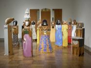 Marisol, The Party, 1965-66. Assemblage of 15 freestanding, life-size figures and 3 wall panels, with painted wood and carved wood, mirrors, plastic, television set, clothes, shoes, glasses, and other accessories. Dimensions variable. 