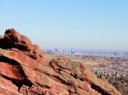 A view of denver over red rocks
