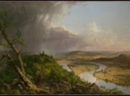 View of the painting described in this story. A knarled tree sits in the foreground of the left corner and a storm rages in the distance of this same half. 