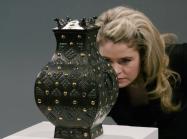 Expert looks at bronze vessel 