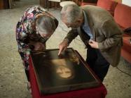 Dianne Modestini and Ashok Roy inspecting the Naples copy of the Salvator Mundi (2019)