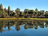 Angkor Wat temple makes up skyline beyond body of water 
