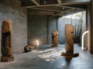 Objects of Common Interest, Tube Light I and Tube Light II, 2019, installed among Isamu Noguchi’s monumental late-career basalt sculptures in The Noguchi Museum’s indoor-outdoor galleries.
