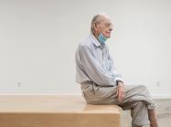 Photo of Wayne Thiebaud taken by Max Whittaker, Posted by Acquavella Galleries. artist is shown seated in the gallery space