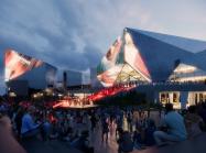 People attending an event held in the square in front of the European Film Centre CAMERIMAGE building, 2022. License