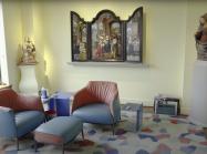 Room with renaissance altarpiece, renaissance sculpture, and modern furniture
