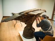 Pizzagalli Director of Conservation Nancie Ravenel at work conserving folk art sculpture by Laban Smith Beecher from the mid-19th century. Photography by Andy Duback