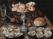 Dutch still life of a table top with oysters, bread and other foods