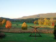 photo of Storm King Art Center, a landscape with rolling green hills dotted with large sculptures