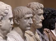 a line of of marble busts receding into the distance. 