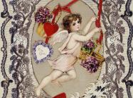 A cupid figure is framed by ornate, organic artwork