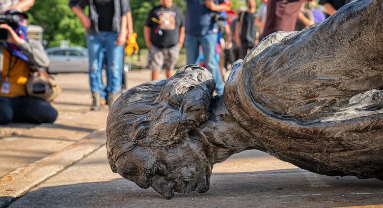 "The fallen Christopher Columbus statue outside the Minnesota State Capitol after a group led by American Indian Movement members tore it down in St. Paul, Minnesota, on June 10, 2020." 