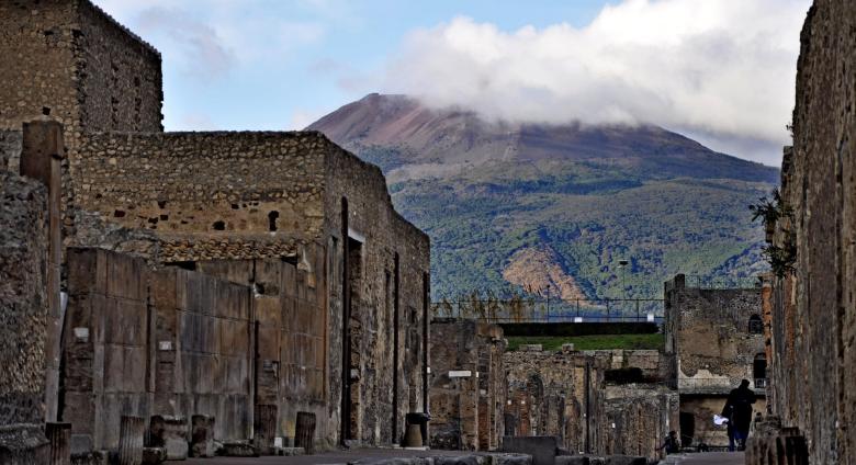 Pompeii excavations with Mount Vesuvius, 2011. License