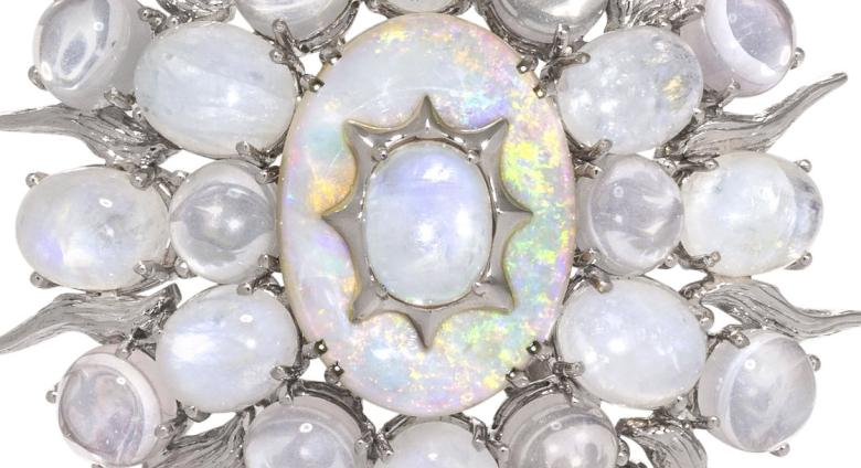 moonstone brooch in the shape of an oval with star points