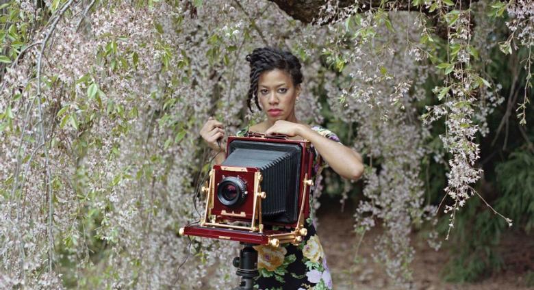 photo of Deana Lawson with a large-format camera
