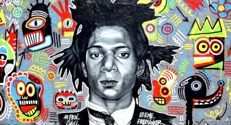 Graffiti of Jean-Michel Basquiat by Eme Freethinker and Pen Chill in Berlin. WikiCommons.