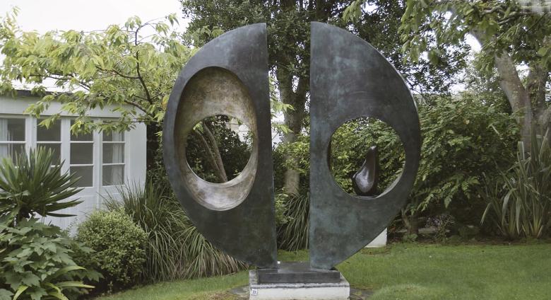 View of "Two Forms (Divided Circle)" in garden at Hepworth Museum