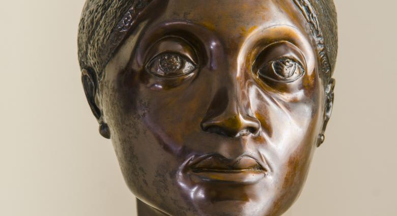 bronze bust of woman's head