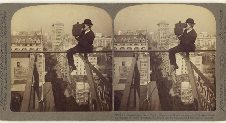 Underwood & Underwood (American, 1881 - 1940s), Photographing New York City - on a slender support 18 stories above pavement of Fifth Avenue., 1905. Gelatin silver print.