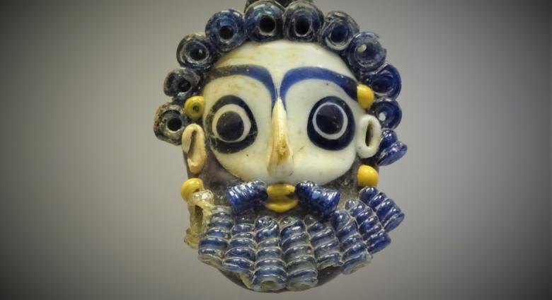 Glass pendant, 4th or 3rd century BC.