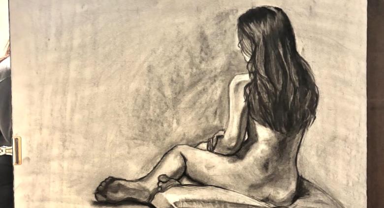 An Eastern Illinois University student’s charcoal figure drawing of Sarah Housh during a life-drawing session. (Photo by Sarah Housh/Artwork by an Eastern Illinois University student)