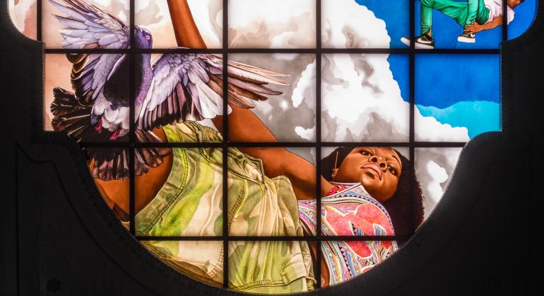 Kehinde Wiley stained glass woman showing a young black woman looking down at the viewer