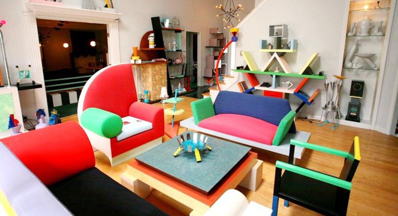 Living room installation filled with bright furniture made from odd shapes. 