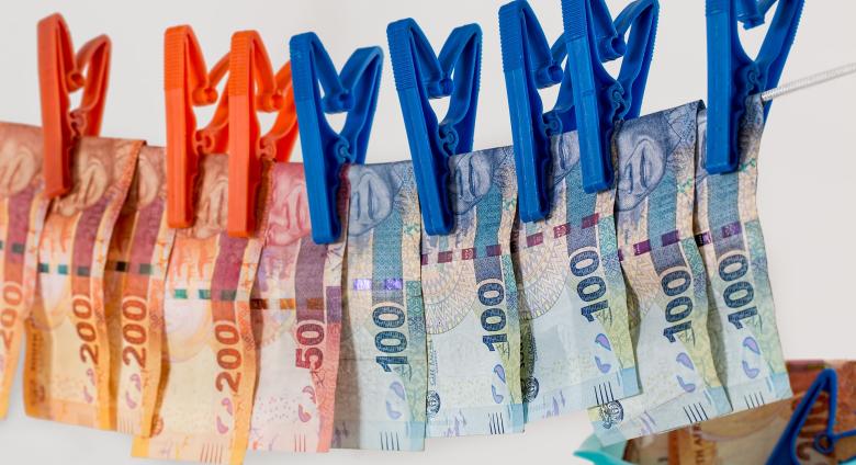 euros bills hanging to dry on a clothes line