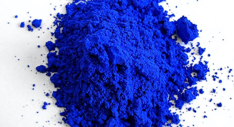 pile of Yinmn blue pigment in powder form from oregon state labs 