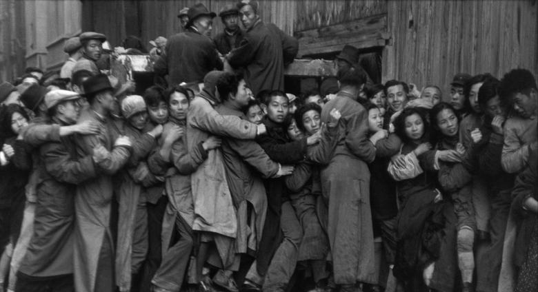 Gold Rush. At the end of the day, scrambles in front of a bank to buy gold. The last days of Kuomintang, Shanghai, 23 December 1948.
