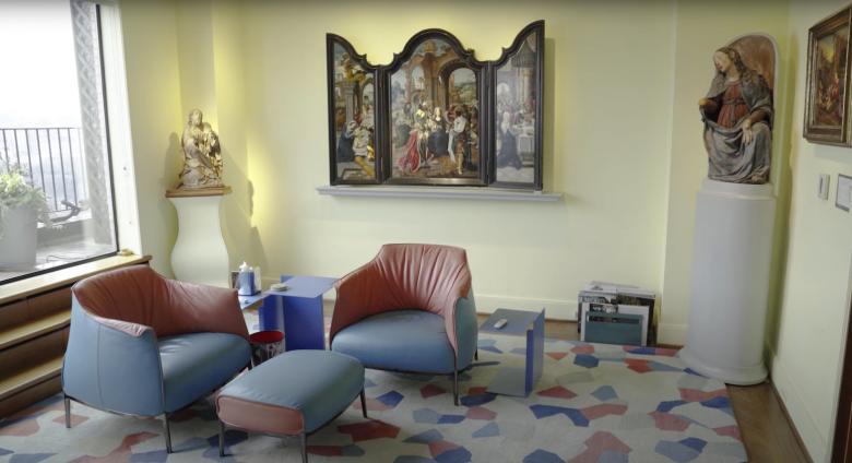Room with renaissance altarpiece, renaissance sculpture, and modern furniture
