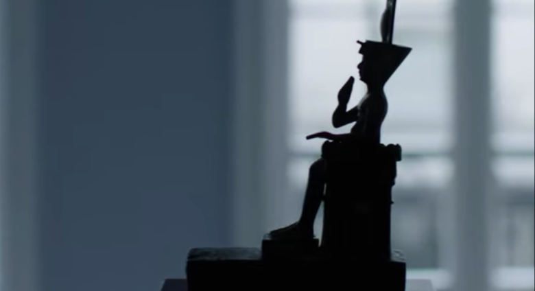 Silhouette of seated Egyptian bronze   