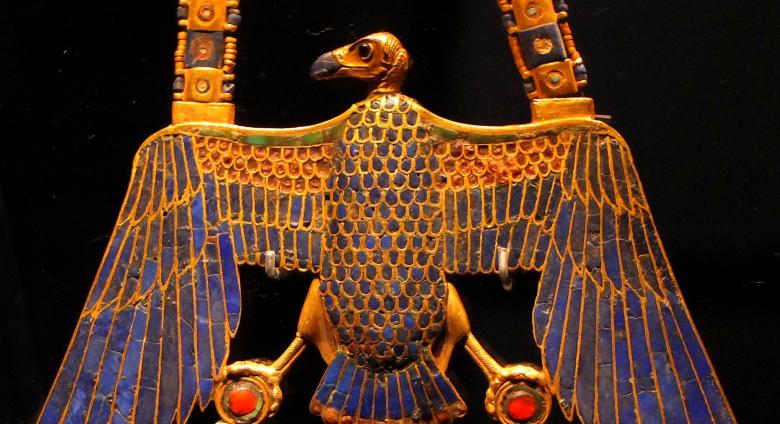 egyptian pectoral amulet in the shape of a vulture, made in gold with lapis lazuli inlay