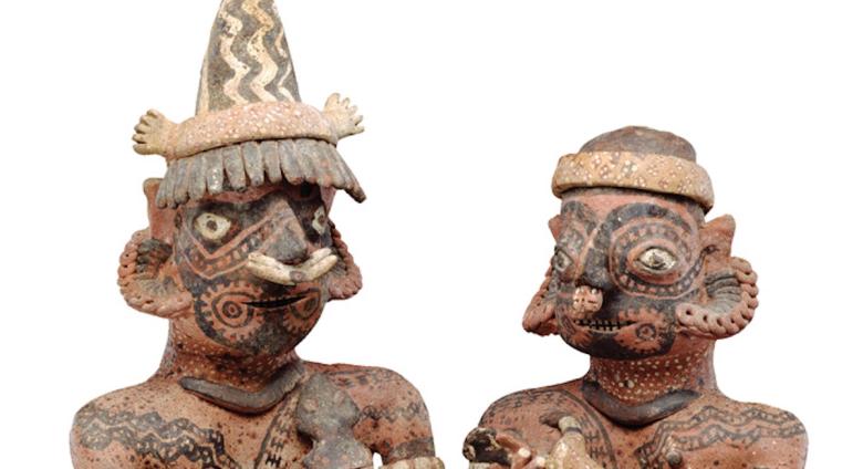 Two ceramic figurines from graves in western Mexico that show two heavily tattooed individuals. Photo: Detroit Institute of Arts.
