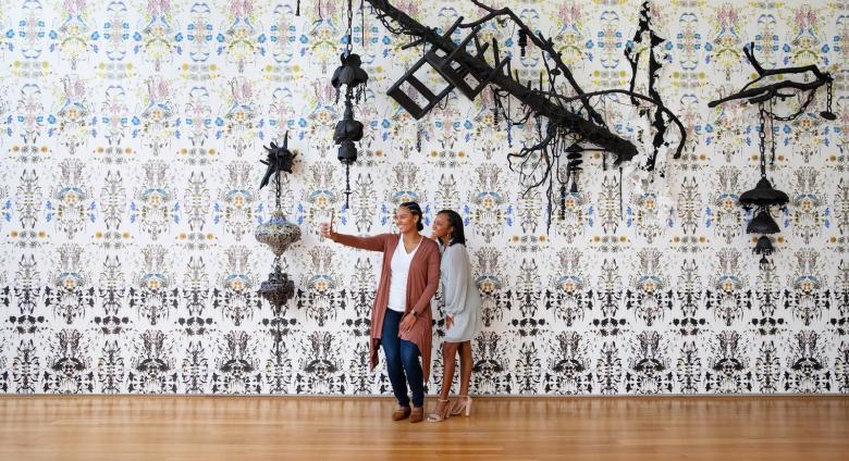 Visitors snap a selfie in front of new commissioned artwork and you did not even know enough to be sorry, 2022, by North Carolina artist Elizabeth Alexander