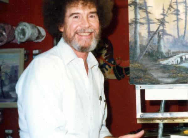 5. Bob Ross- Happy Accidents, Betrayal & Greed - Production Still of Bob Ross with a finished painting.