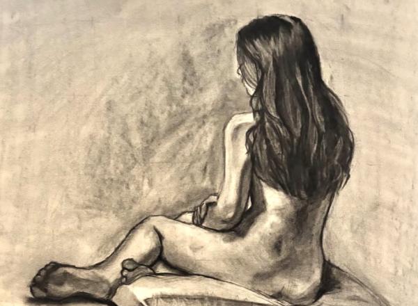 An Eastern Illinois University student’s charcoal figure drawing of Sarah Housh during a life-drawing session. (Photo by Sarah Housh/Artwork by an Eastern Illinois University student)