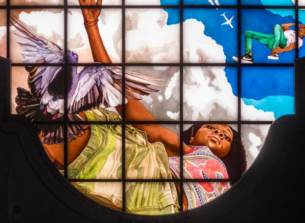 Kehinde Wiley stained glass woman showing a young black woman looking down at the viewer