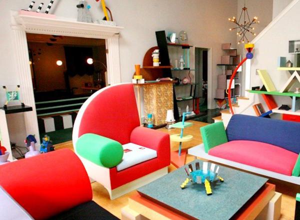 Living room installation filled with bright furniture made from odd shapes. 