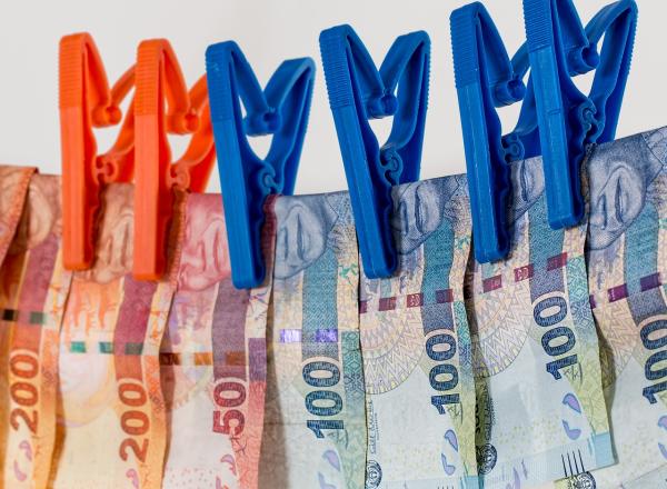 euros bills hanging to dry on a clothes line