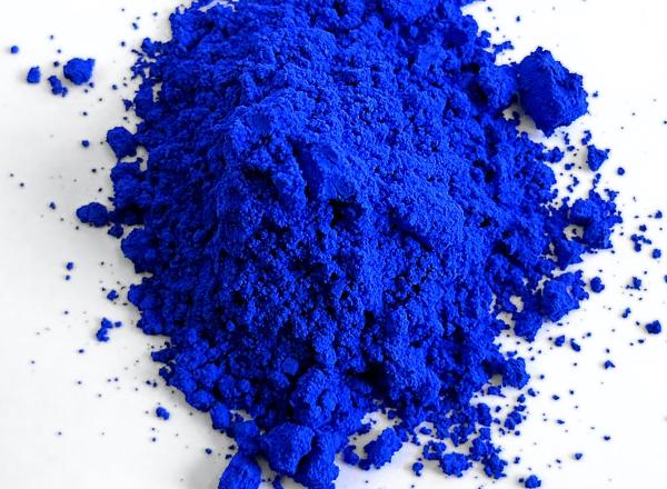 pile of Yinmn blue pigment in powder form from oregon state labs 