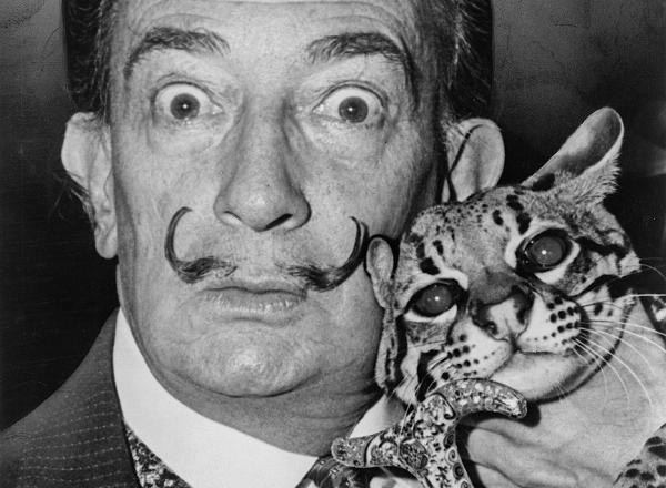 Salvador Dalí holding his pet ocelot, Babou