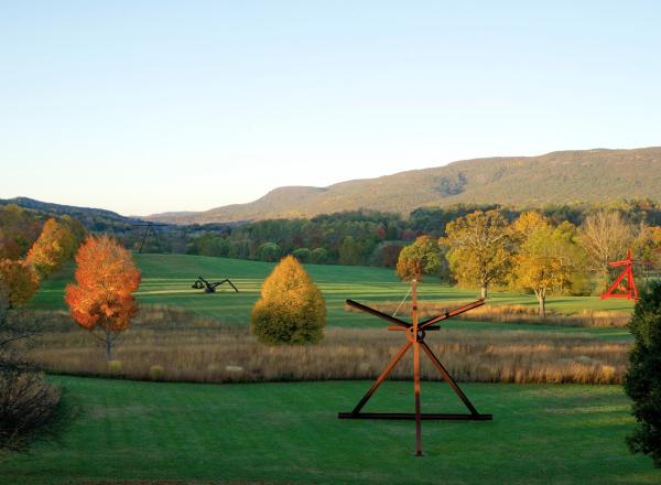 photo of Storm King Art Center, a landscape with rolling green hills dotted with large sculptures