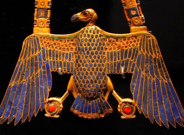 egyptian pectoral amulet in the shape of a vulture, made in gold with lapis lazuli inlay