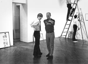 The author with Ray Johnson installing A Lot of Shirley Temple Postcards exhibition, March 1968