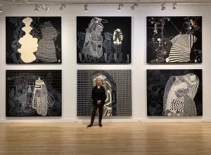 Sarah Amos in front of "Sarah Amos: Chalk Lines" at CUE Art Foundation