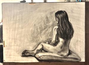 An Eastern Illinois University student’s charcoal figure drawing of Sarah Housh during a life-drawing session. (Photo by Sarah Housh/Artwork by an Eastern Illinois University student)