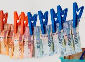 Euros bills hanging to dry on a clothes line