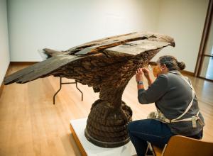 Pizzagalli Director of Conservation Nancie Ravenel at work conserving folk art sculpture by Laban Smith Beecher from the mid-19th century. Photography by Andy Duback